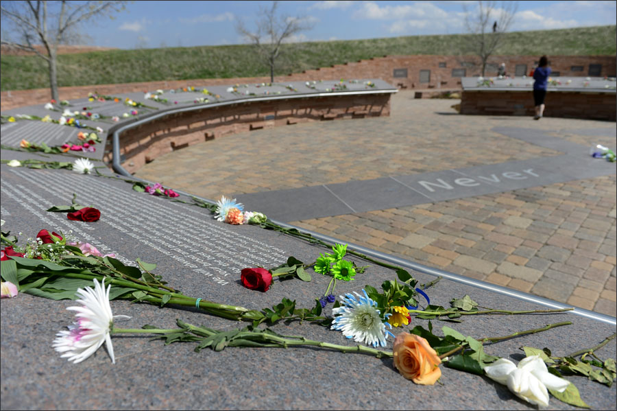 LITTLETON, CO - APRIL 20: Visitors bring flowers and spend time at the Columbine Memorial on Monday, April 20, 2015. Today marks the 16th anniversary of the deadly shooting at Columbine High School which left 12 students and one teacher dead. The school was closed for the day, as it has been every year on this day since the shooting occurred in 1999. (Photo by Kathryn Scott Osler/The Denver Post)
